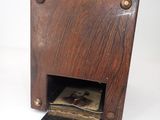 a small wooden box with a picture inside of it