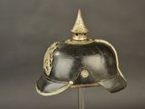a helmet on a stand on a gray background