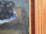 a painting of grapes in a bowl on a table