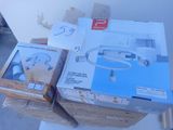 two boxes of electronic devices sitting on top of each other