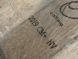a close up of a piece of wood that has a logo on it