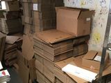 many boxes stacked on top of each other in a room