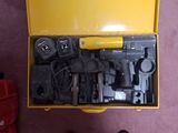 a yellow box with tools inside of it on the floor