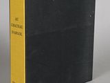 a black book with yellow pages sitting on top of a table