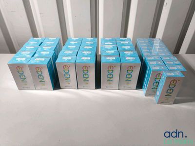 six boxes of blue and white boxes sitting on top of a white table