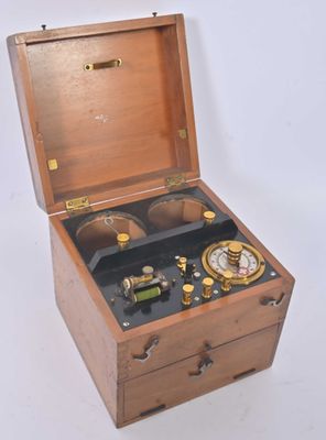 a small wooden box with a clock inside of it