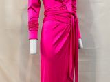 a mannequin dress with long sleeves and a wrap around the waist