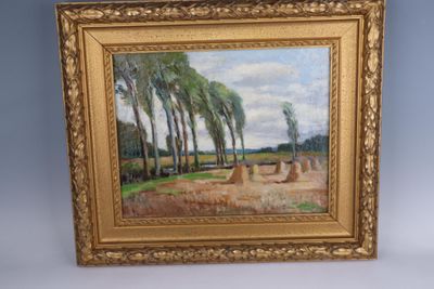 une image représentant un tableau représentant un paysage avec des arbres, dans un cadre doré