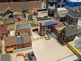 a table with a lot of model buildings on it