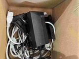 a box with a bunch of wires and a charger inside of it