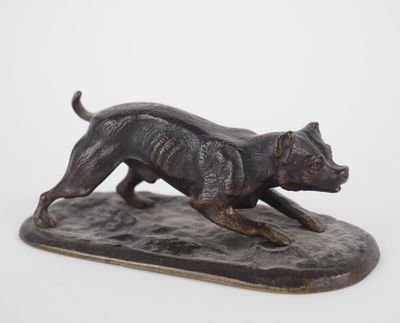 statue of a dog running on a base on a white background