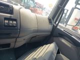 a view of the inside of a vehicle from the driver ' s seat