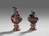 pair of bronze busts of a man and a woman