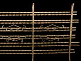 a close up of a metal rack with ropes on top of it