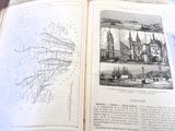 an open book with drawings on it sitting on a table
