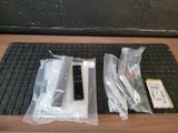 a remote control sitting on a mat next to some other items