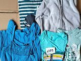 a lot of clothes that are sitting in a box
