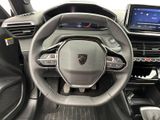 the interior of a car with a steering wheel and dashboard controls