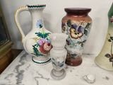 three vases sitting on a table next to each other