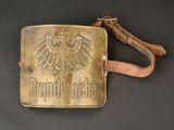 an old belt buckle with a german eagle on it
