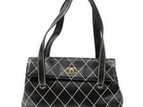 a black and white handbag on a white background