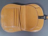 a close up of a wallet with a card holder on top of it