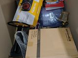 a cardboard box filled with many different types of items