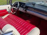 a red and white interior of a classic car