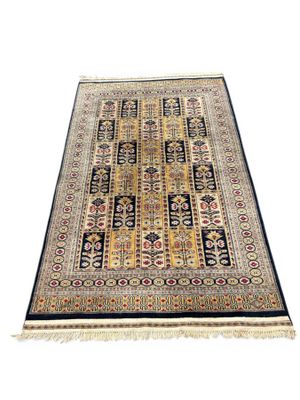an oriental rug with a black border and a yellow border
