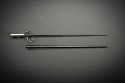 a pair of swords on a gray background