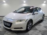 a picture of a white honda civic car in a showroom