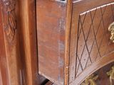 a close up of a wooden cabinet with a drawer