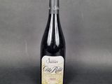 a bottle of wine sitting on top of a table
