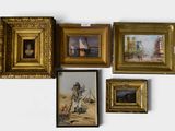 four framed pictures on the wall of a room