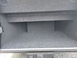 the back of a car with the trunk door open and the trunk door open