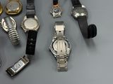a lot of watches that are sitting on a table