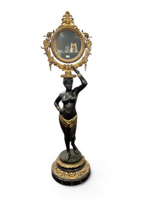 statue of a woman holding a mirror on her head