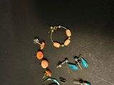 a lot of different bracelets that are on the table