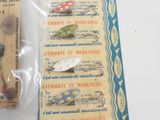 several different types of fishing lures in a package