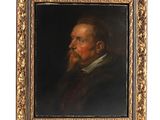 un tableau représentant un homme barbu dans un cadre en or