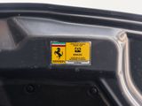 a close up of a ferrari badge on a car ' s bumper