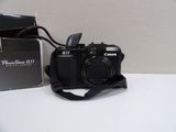 a camera that is sitting on a table next to a box