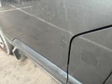 a close up of a car door handle with a sticker on it