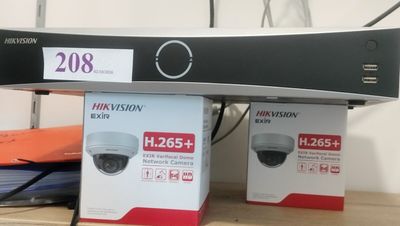 two boxes that are sitting on a shelf next to each other