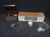 an old radio and other electronics on a black surface
