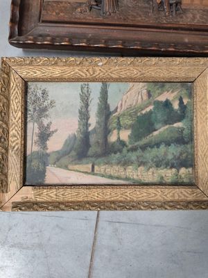 a picture of a painting hanging on a wall next to a dresser