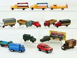 many different types of toy trucks in a display case