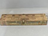 an old metal tool box sitting on top of a white surface