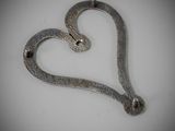 a metal snake that is shaped like a heart