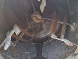 a close up of a metal pipe with rust in it